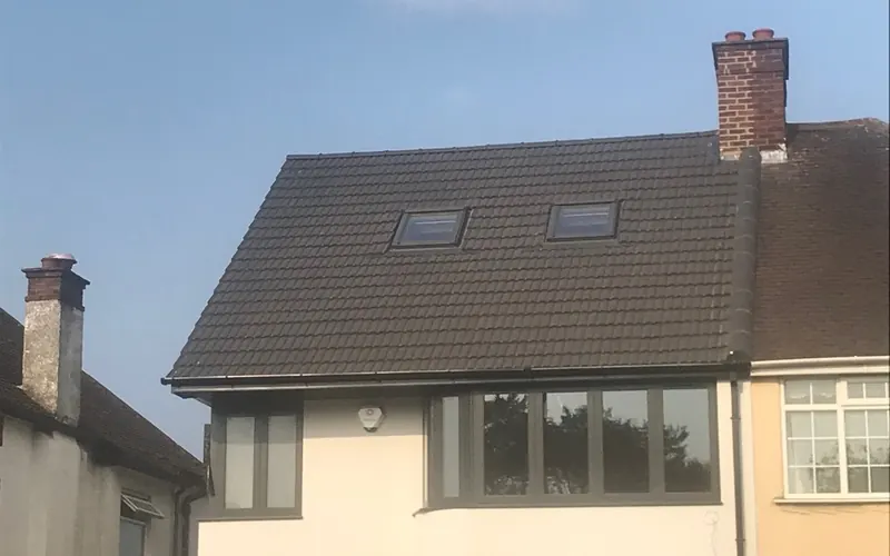 New tiled roof with roof windows fitted by JFC Roofing and Building on a semi-detached house